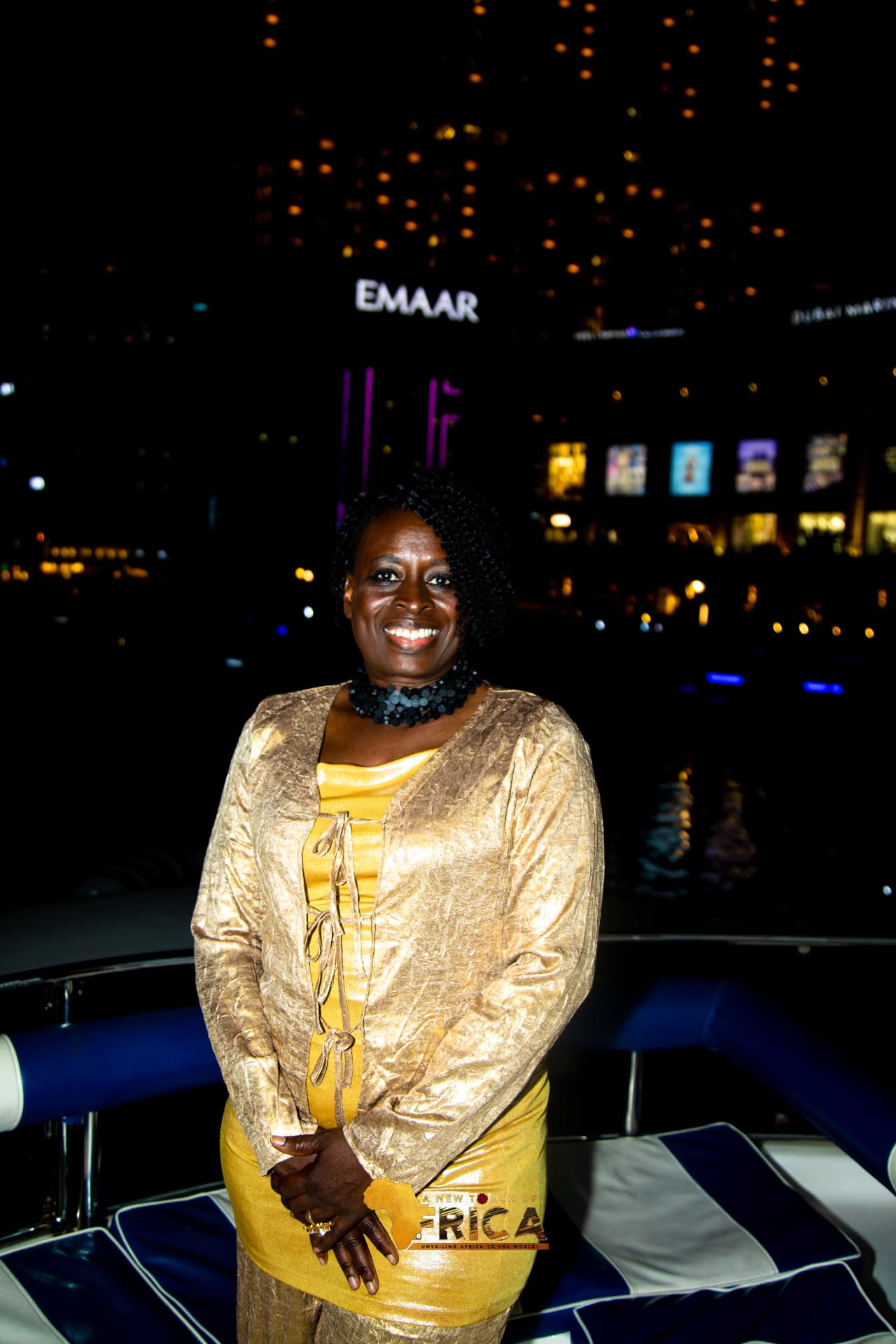 Guest in gold couture aboard the ANTOA yacht party at Dubai Marina
