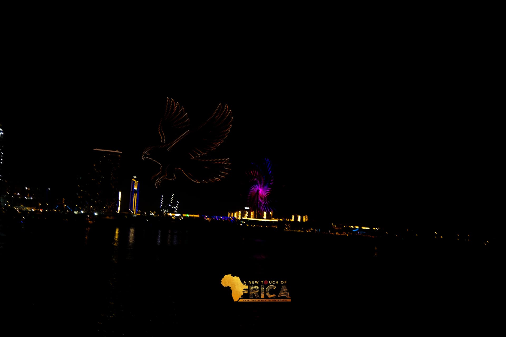 Eagle drone light show over the Dubai skyline at night